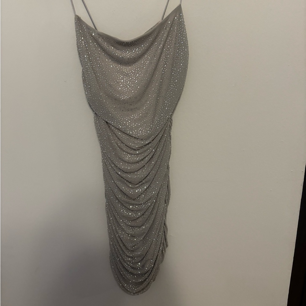 Super flattering, sparkling dress, fits to the body.